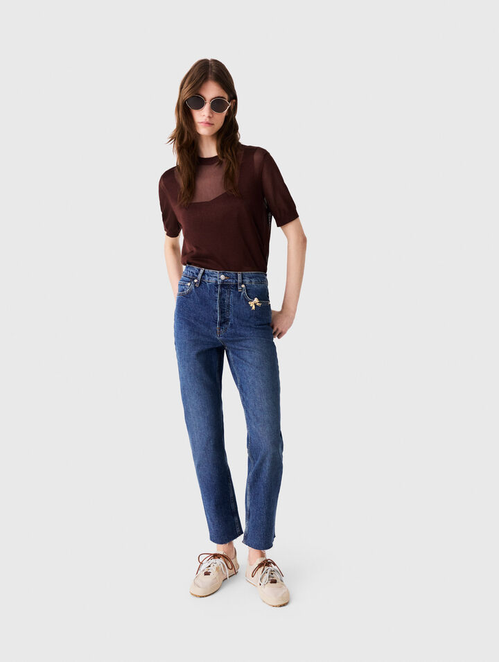 Jeans slim con spilla