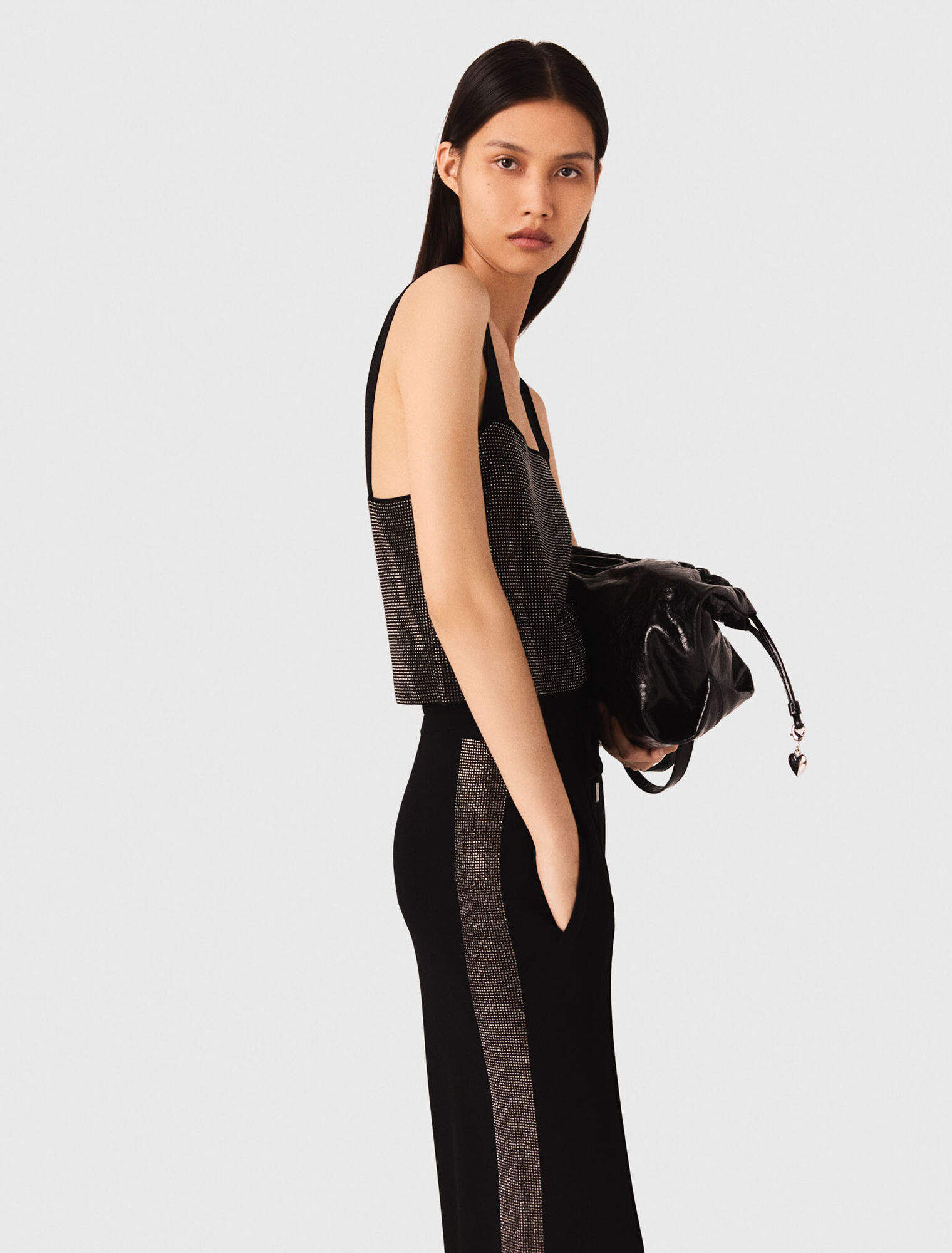 Top in maglia con bretelle e strass