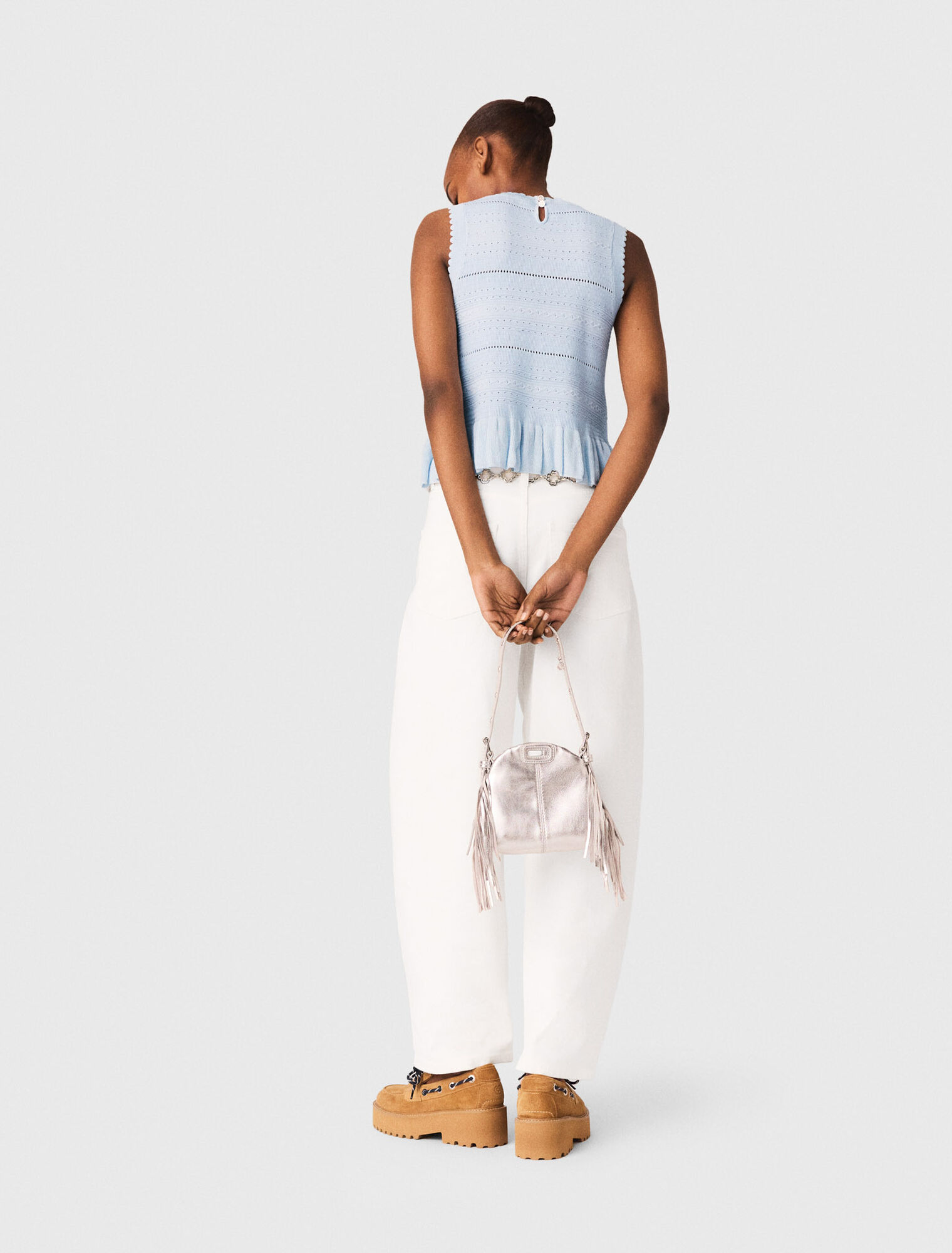 Top in maglia con volant