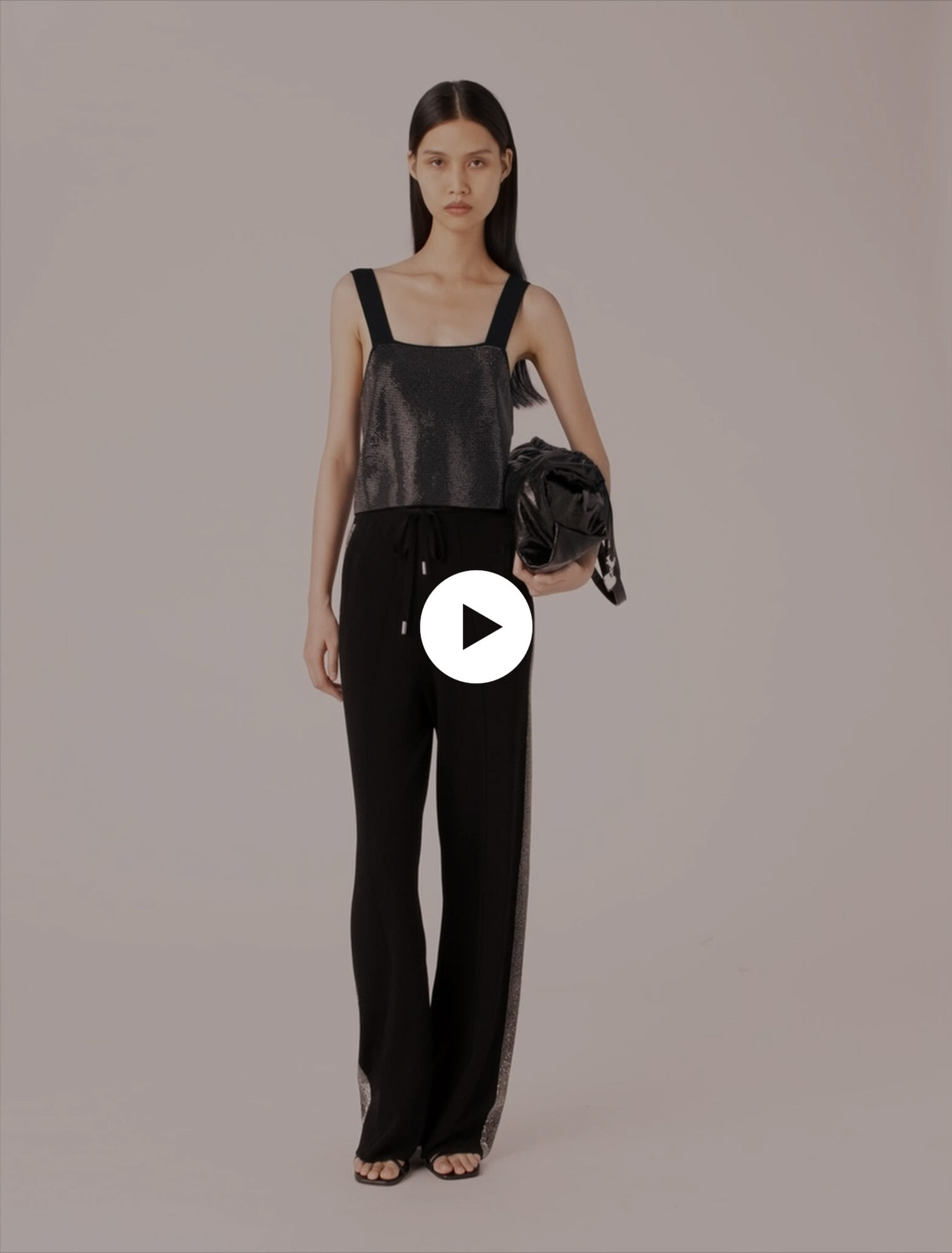 Top in maglia con bretelle e strass