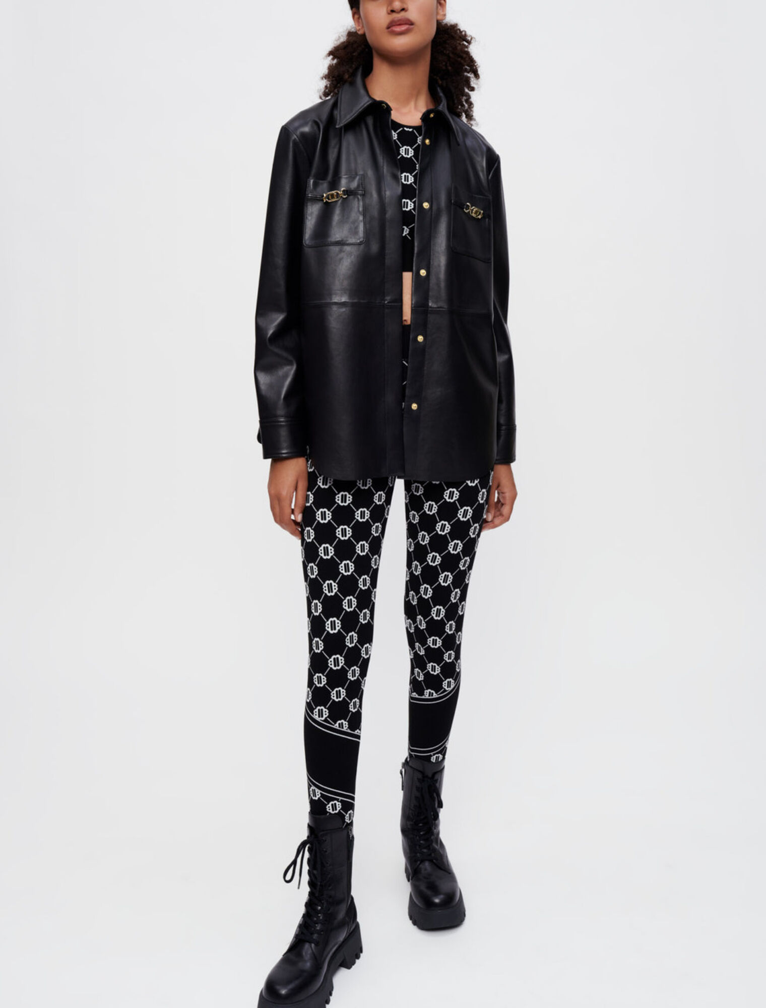 Camicia in pelle nera a morsetti dorati