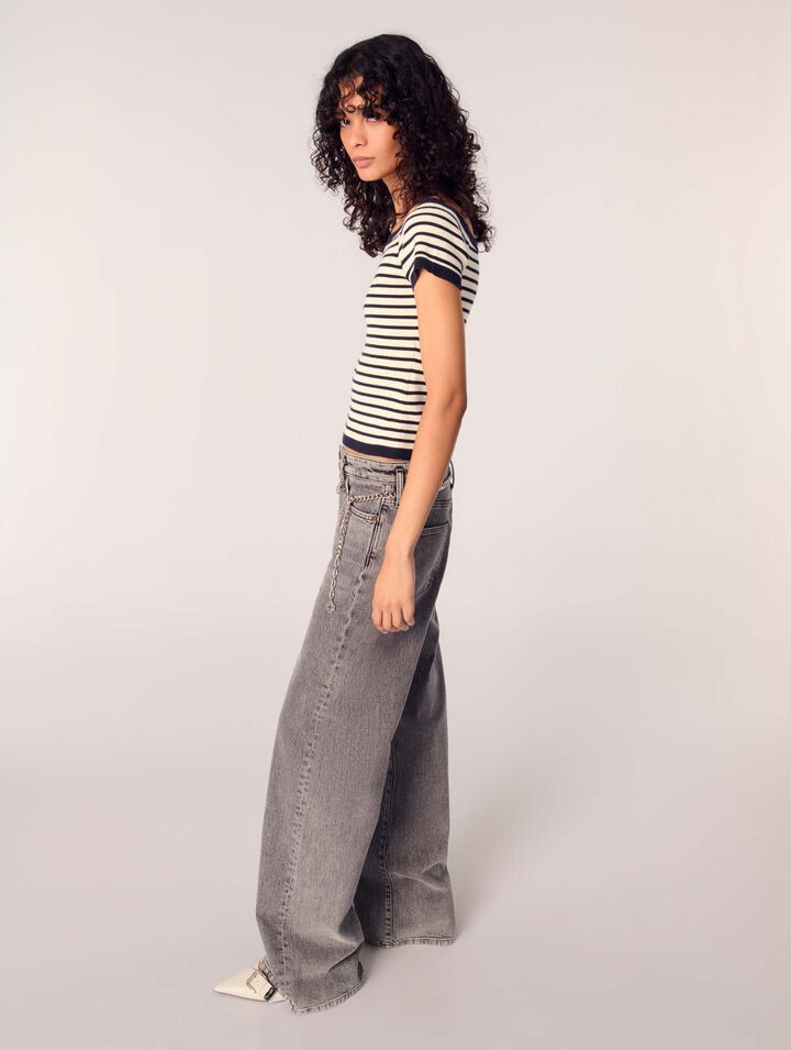 Jeans larghi e cintura a maglie