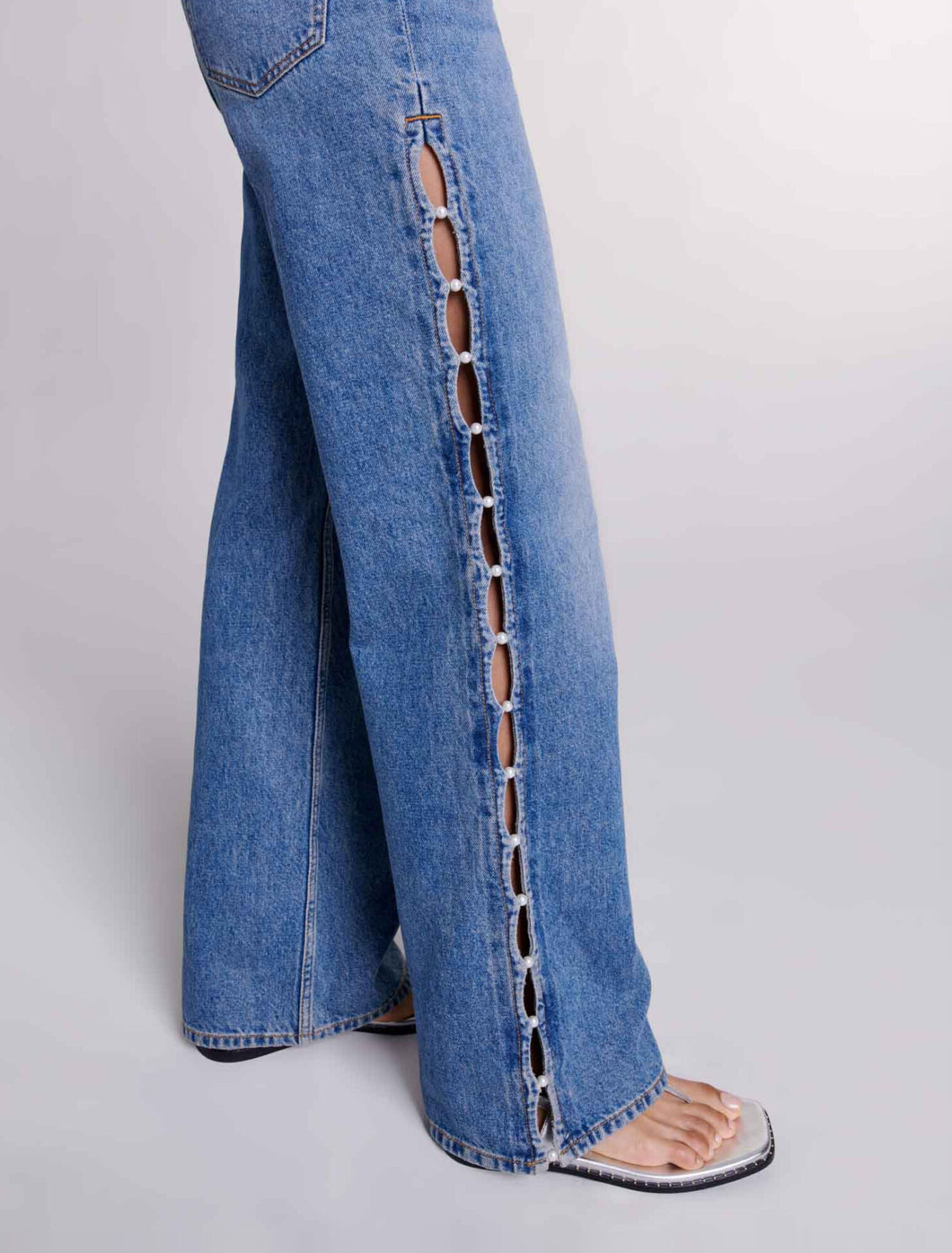 Jeans dritti traforati con perline