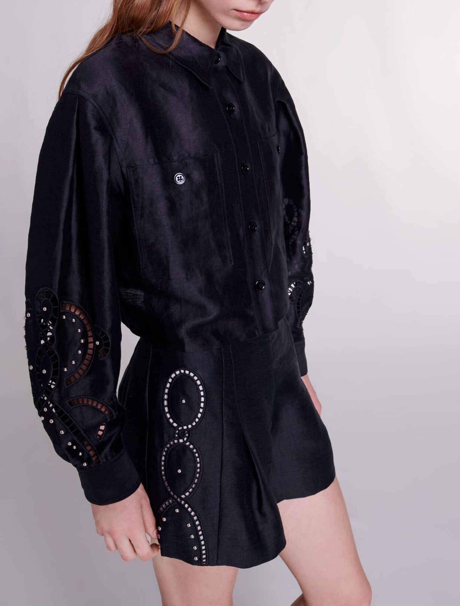 Shorts lino traforato con rivetti