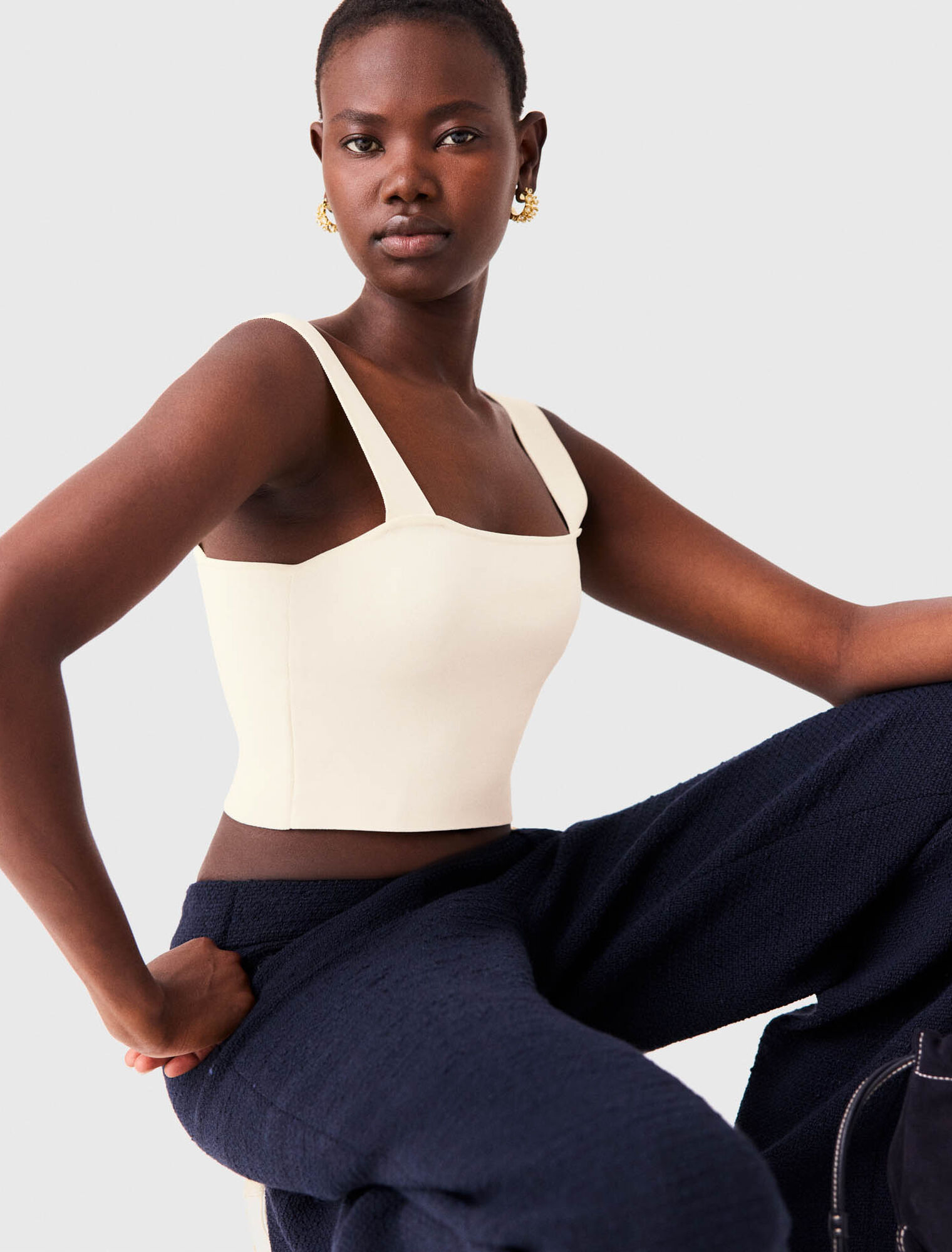 Top crop in maglia con spalline