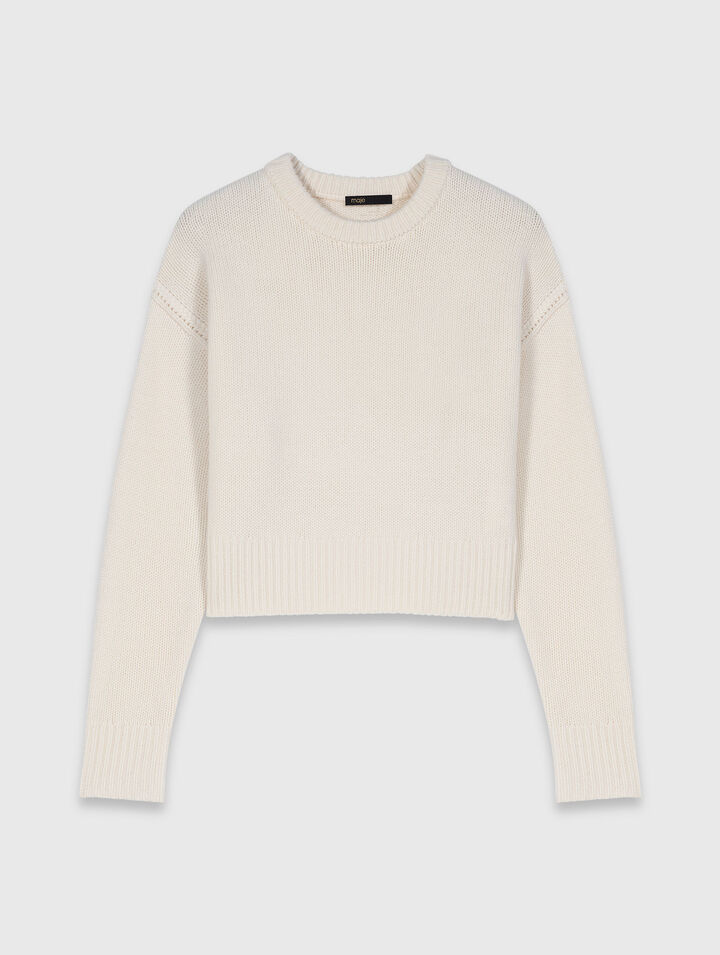 Pullover con spilla floreale