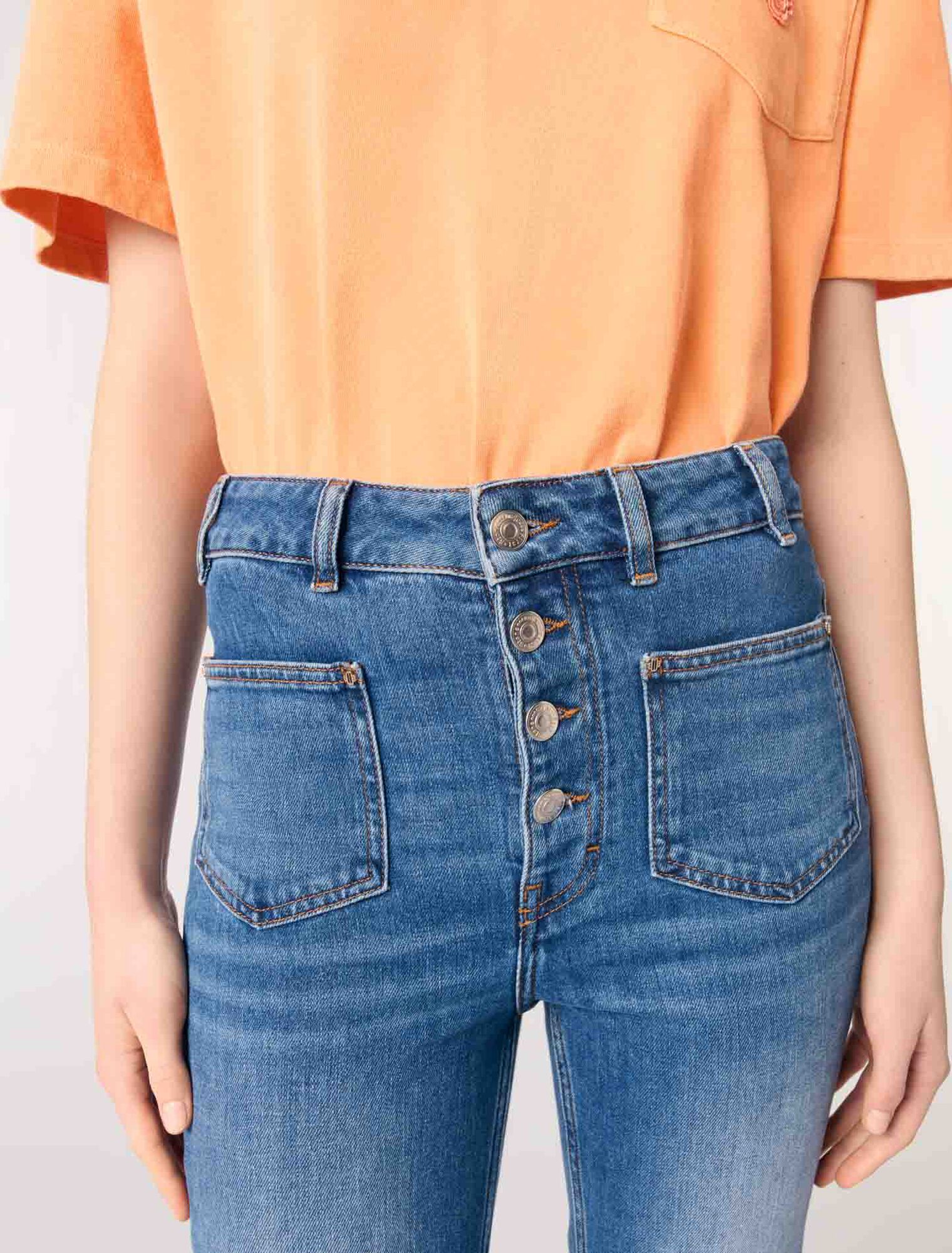 Jeans in denim con tasche