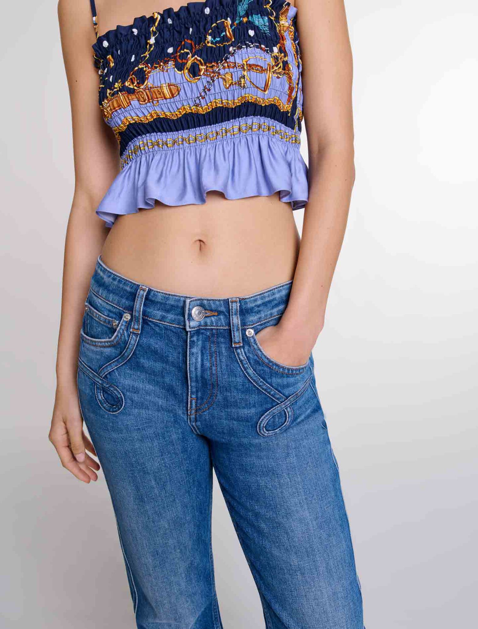 Jeans flare con tasche ricamate