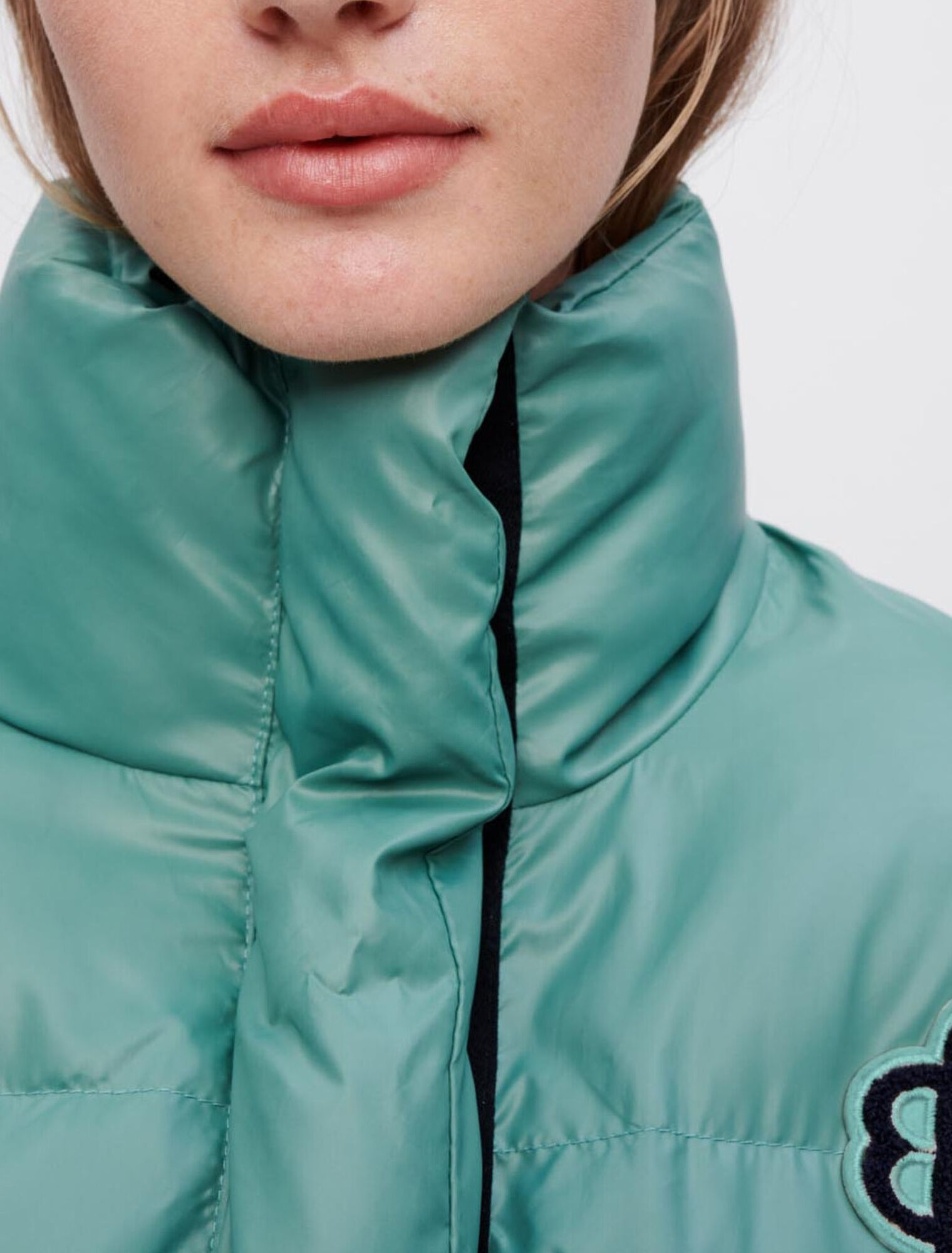 Piumino verde applicazione Clover Maje