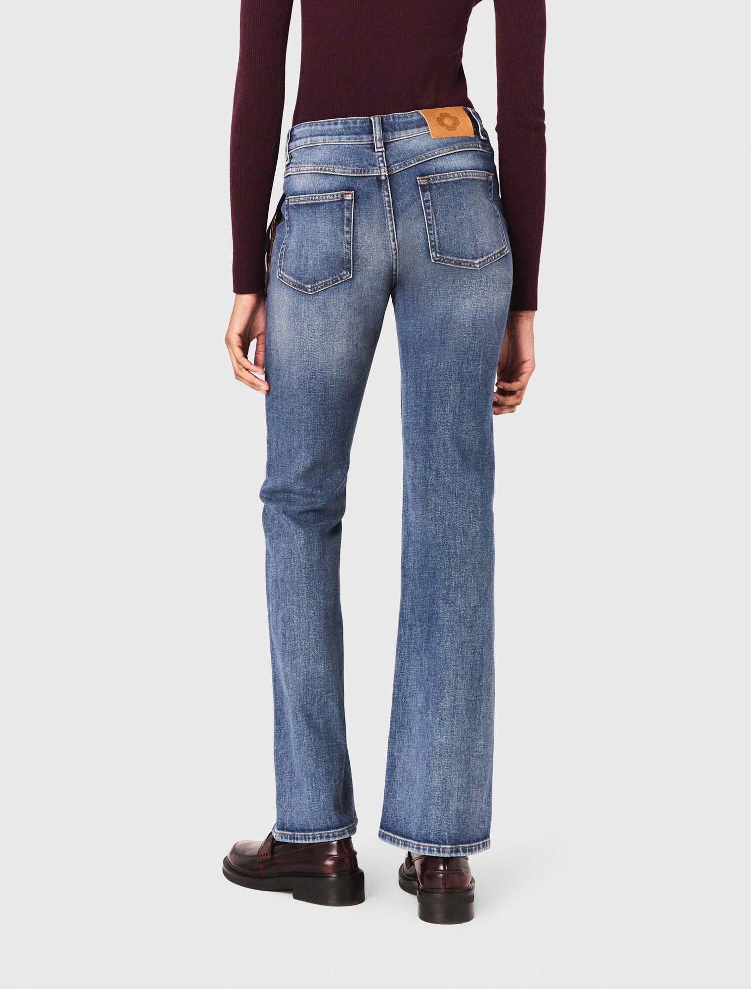 Jeans bootcut con tasche con zip