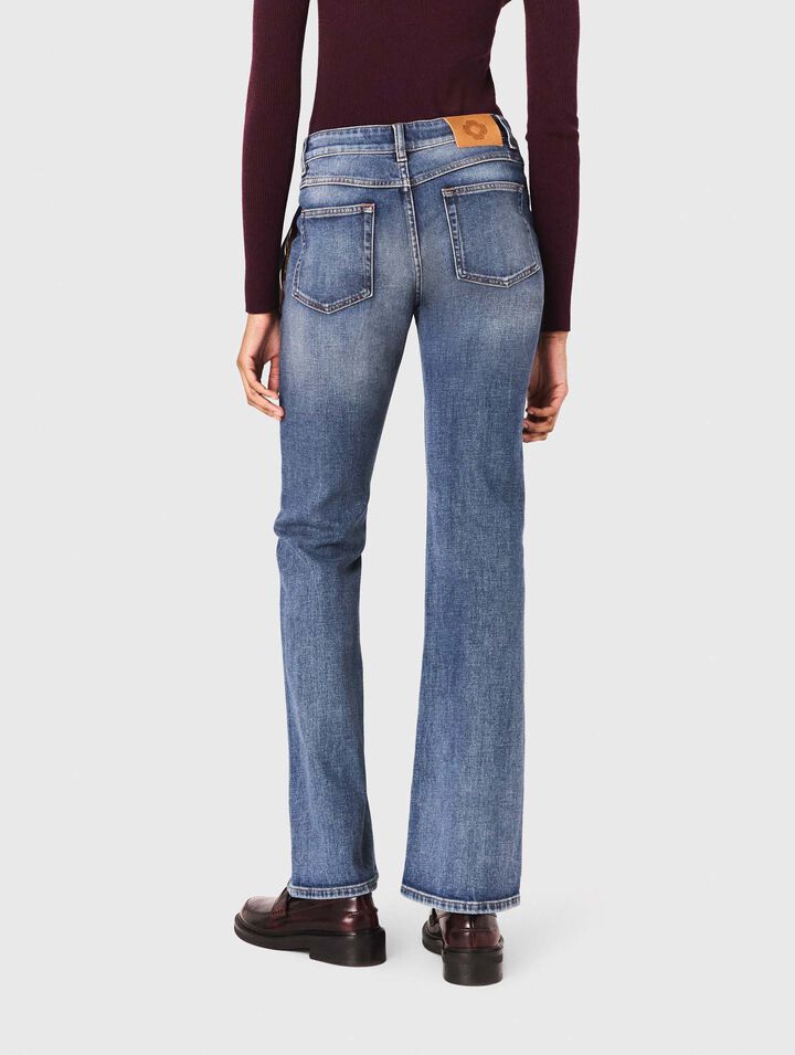 Jeans bootcut con tasche con zip