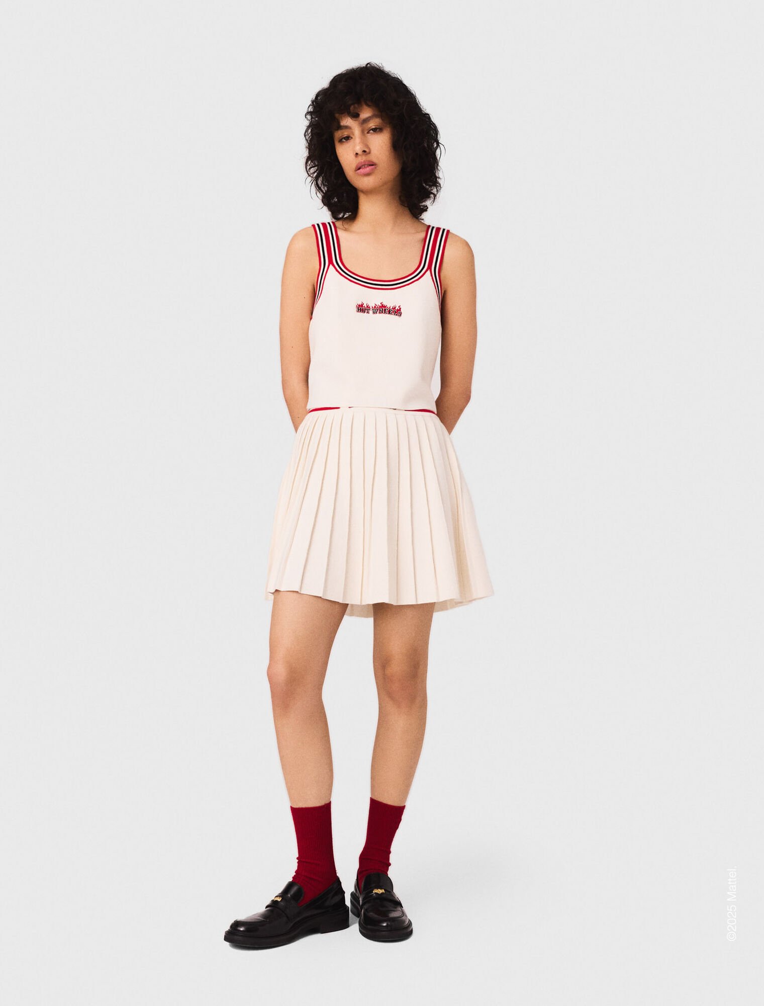 Gonna corta plissettata in maglia