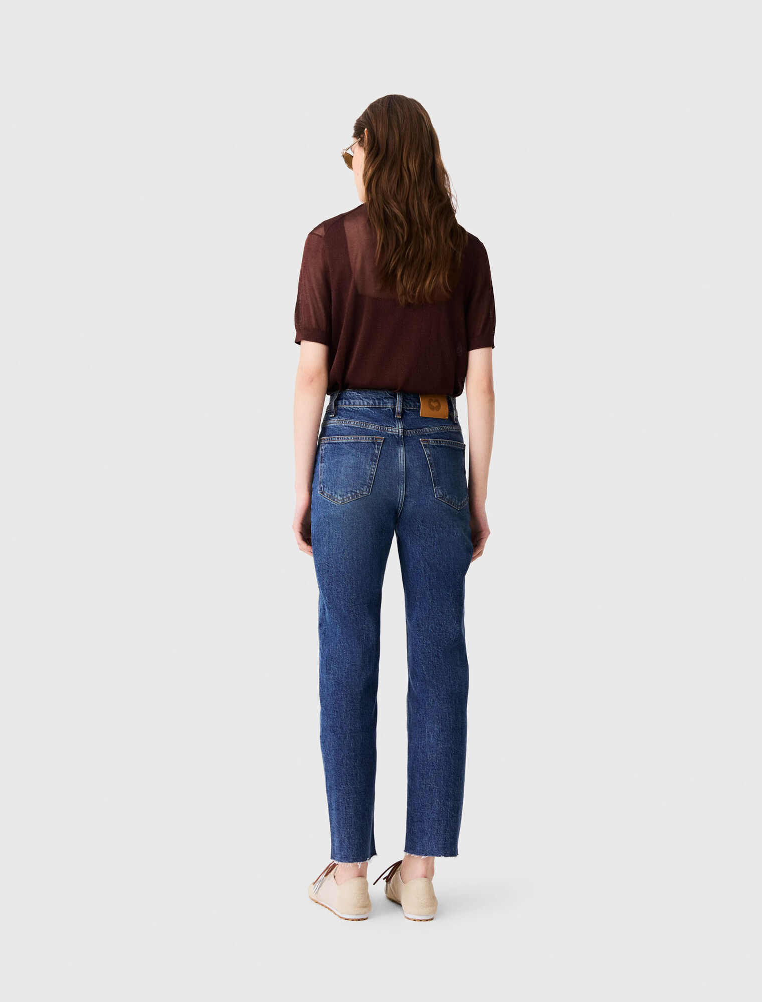 Jeans slim con spilla