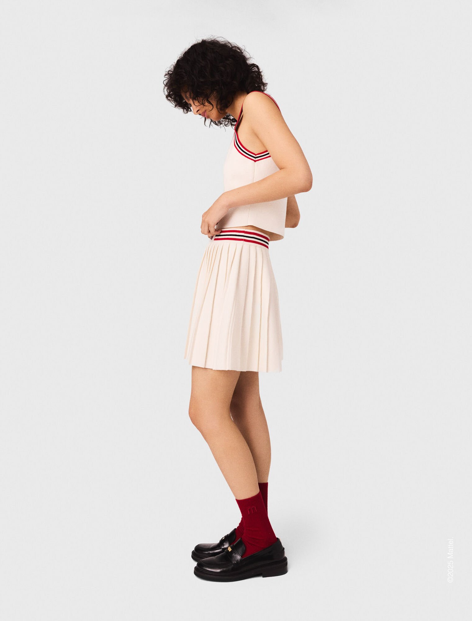 Gonna corta plissettata in maglia
