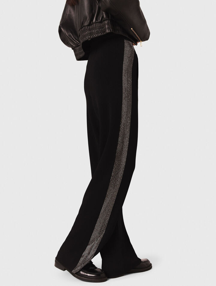 Pantaloni con banda strassata