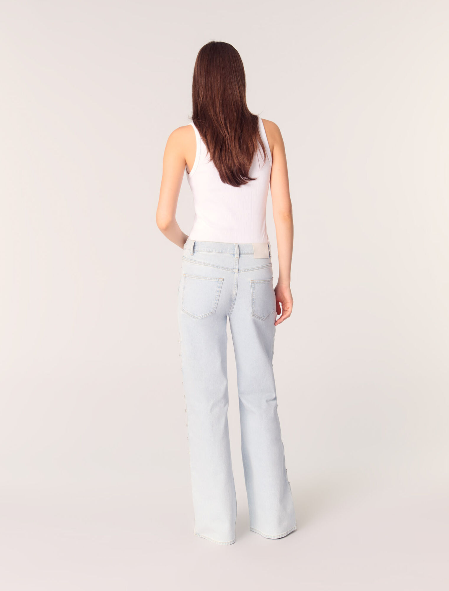 Jeans larghi con cut-out e strass