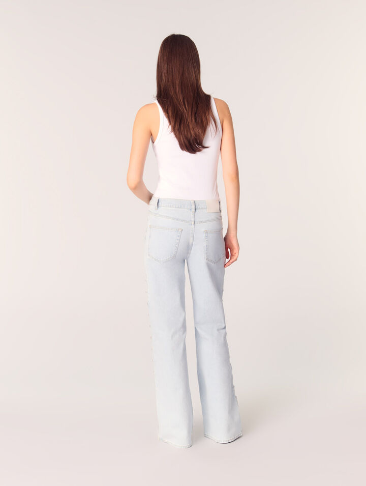 Jeans larghi con cut-out e strass