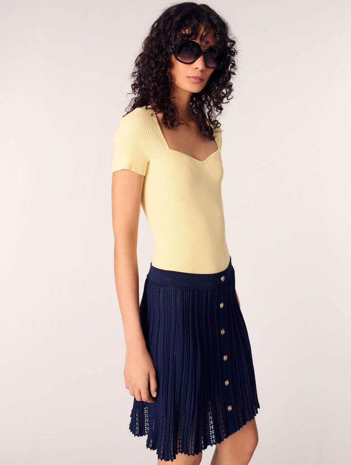 Gonna corta in maglia intrecciata