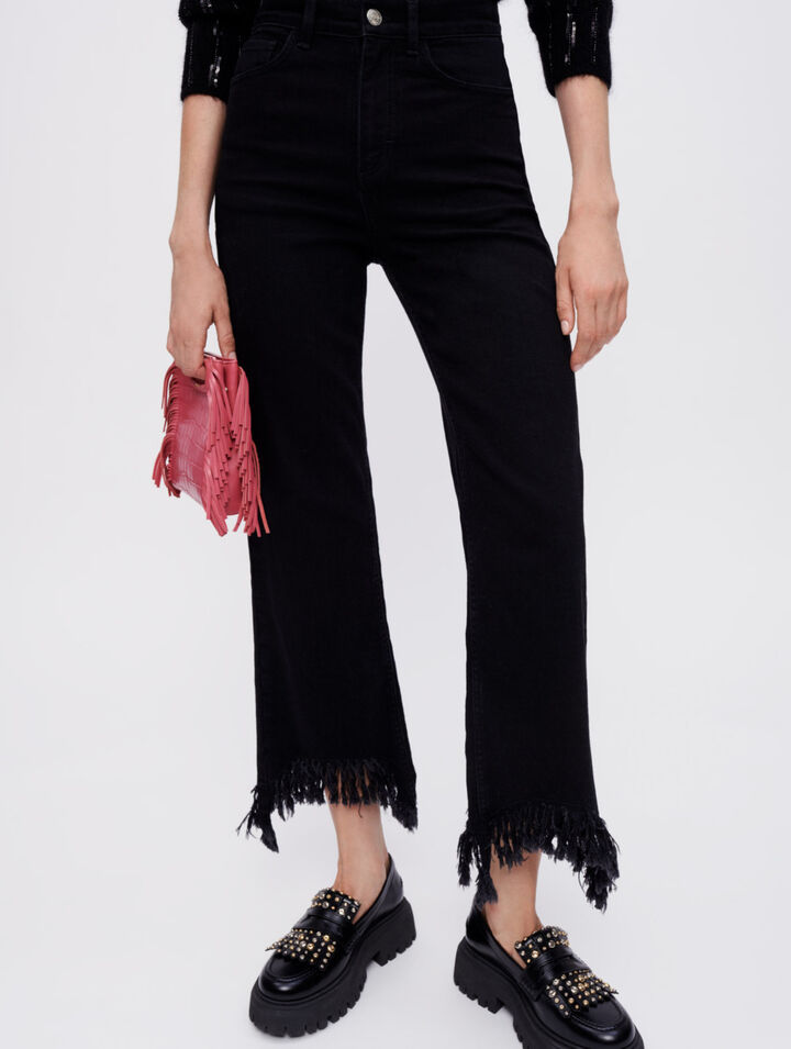 Jeans a vita alta con fondo strappato