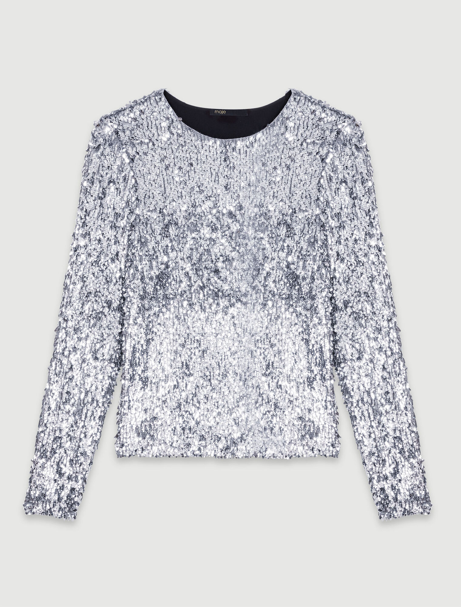 Top a maniche lunghe e paillettes