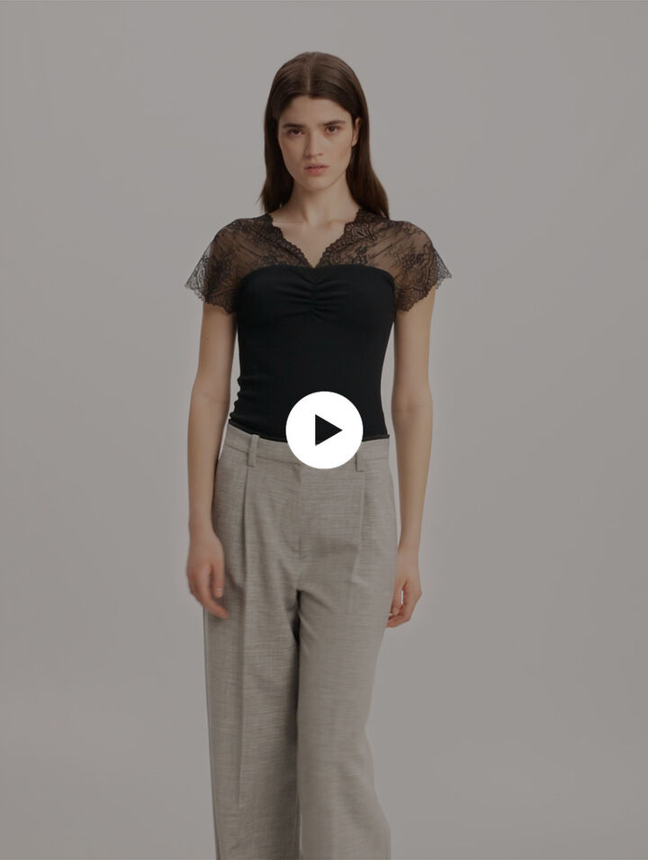 Top in jersey con applicazioni in pizzo
