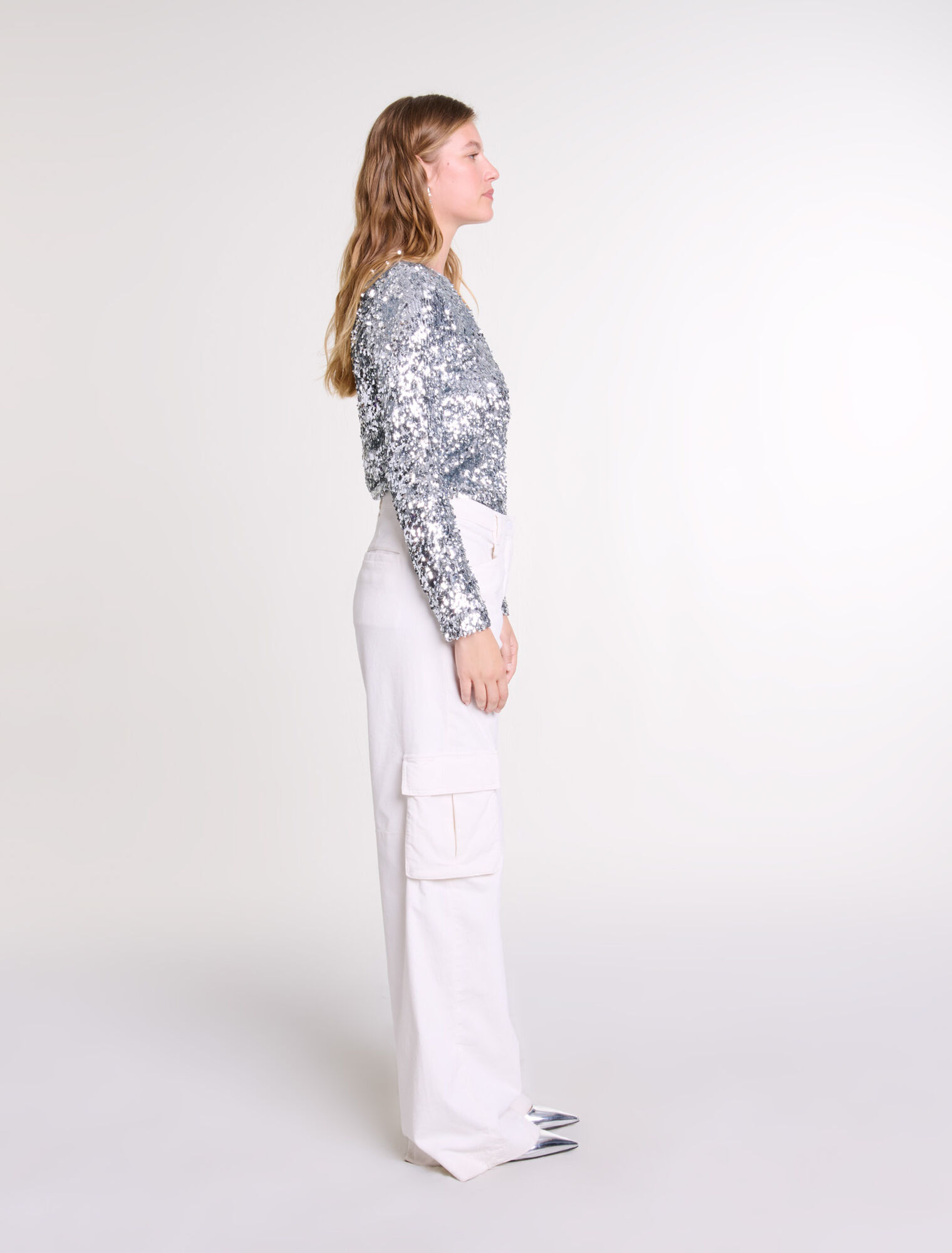 Top a maniche lunghe e paillettes