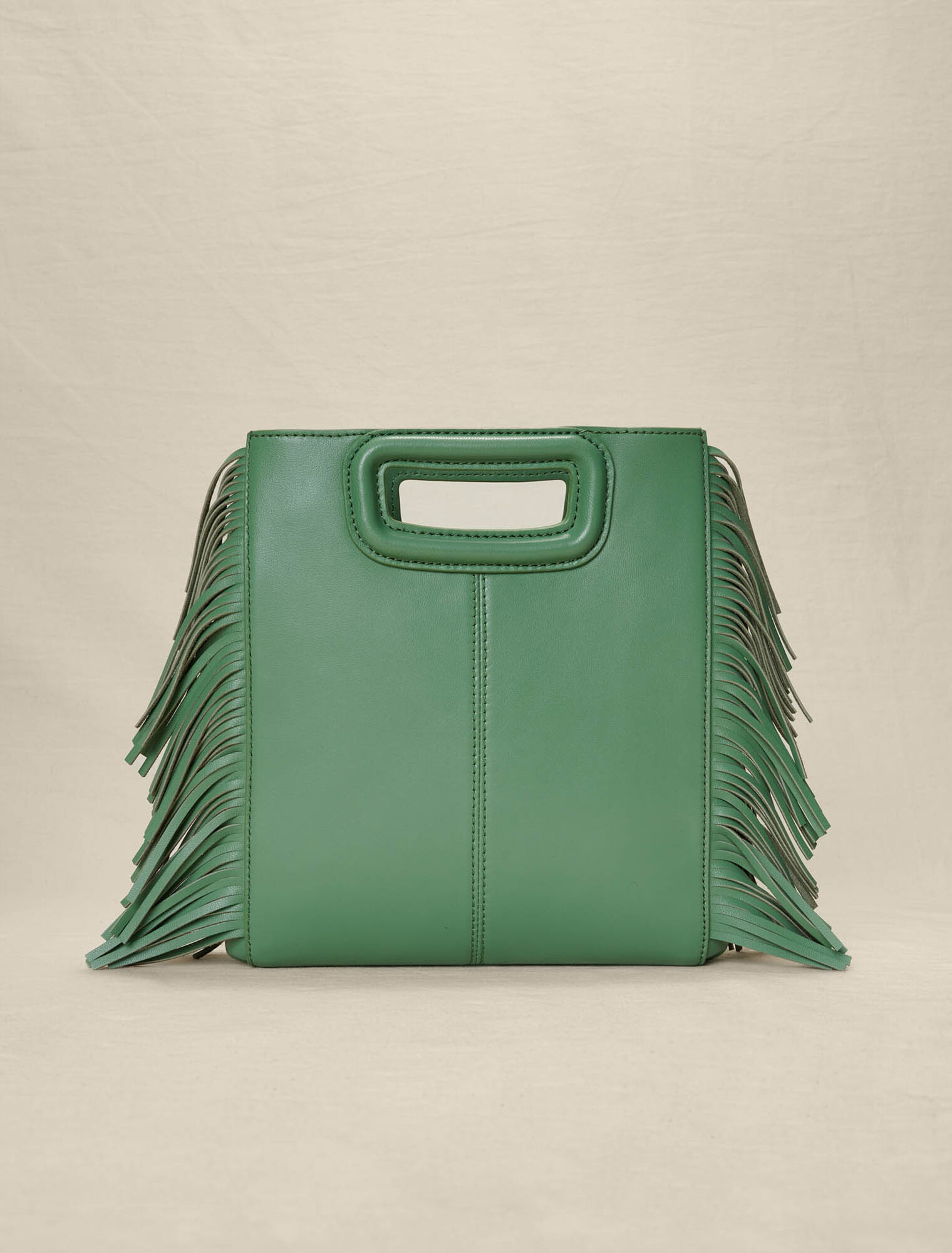 Borsa M con frange in pelle traforata