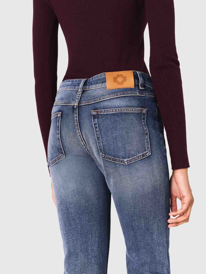 Jeans bootcut con tasche con zip