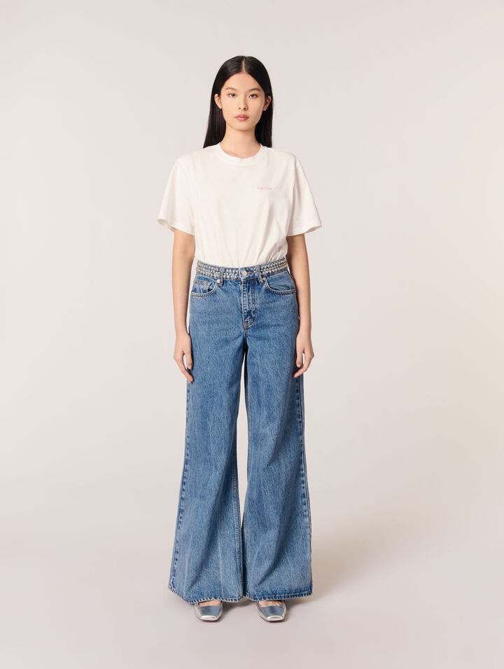 Jeans flare con vita borchiata
