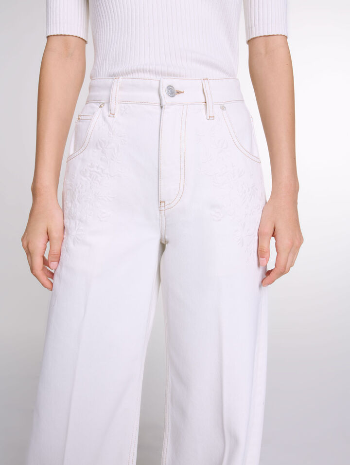Jeans a gamba larga a vita alta ricamati