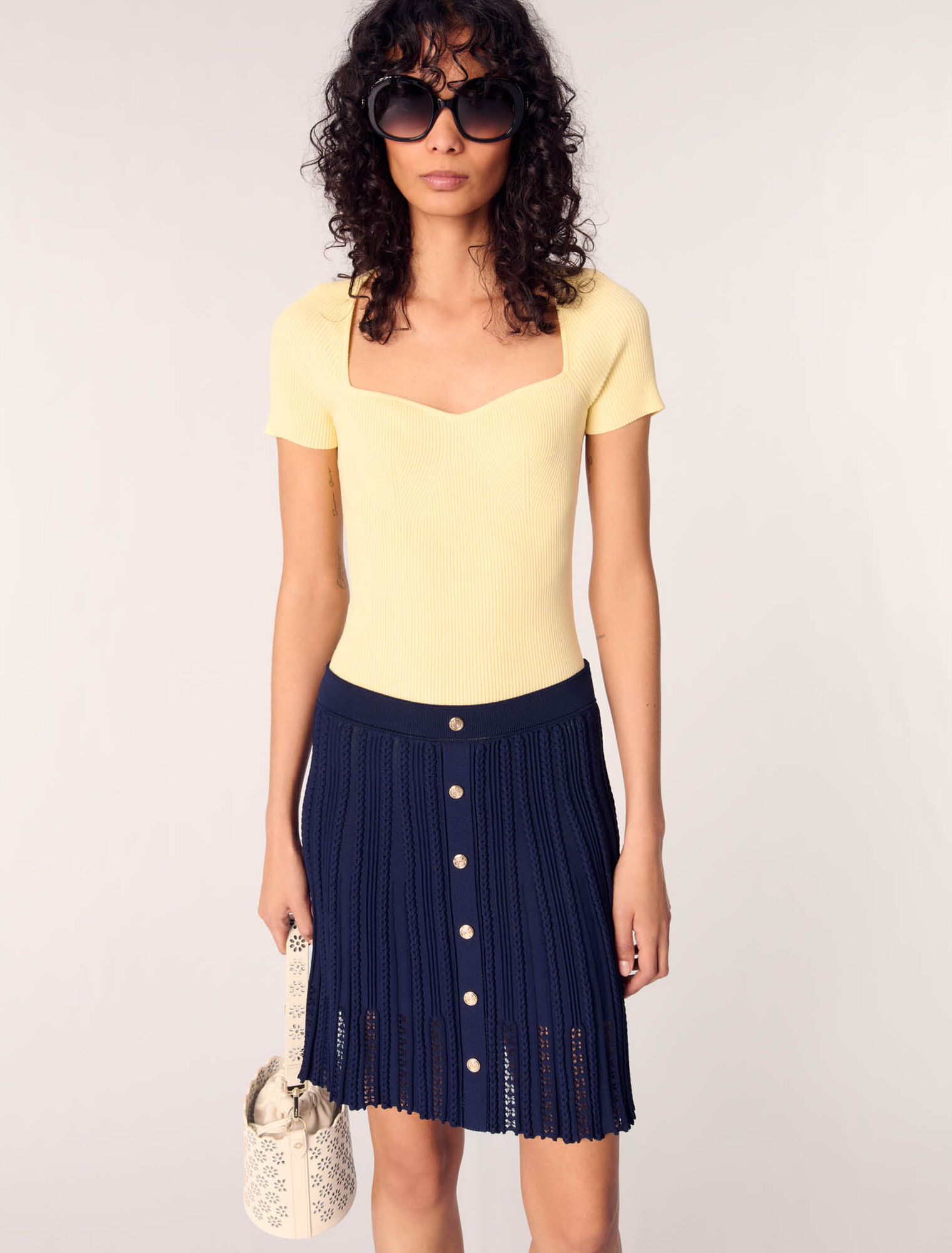 Gonna corta in maglia intrecciata