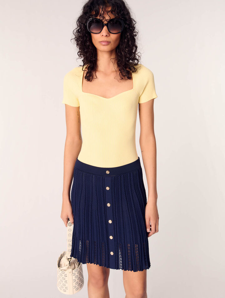 Gonna corta in maglia intrecciata