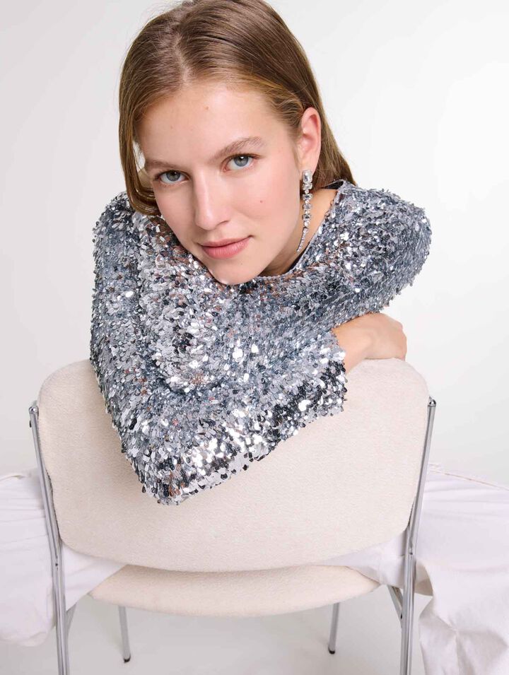 Top a maniche lunghe e paillettes
