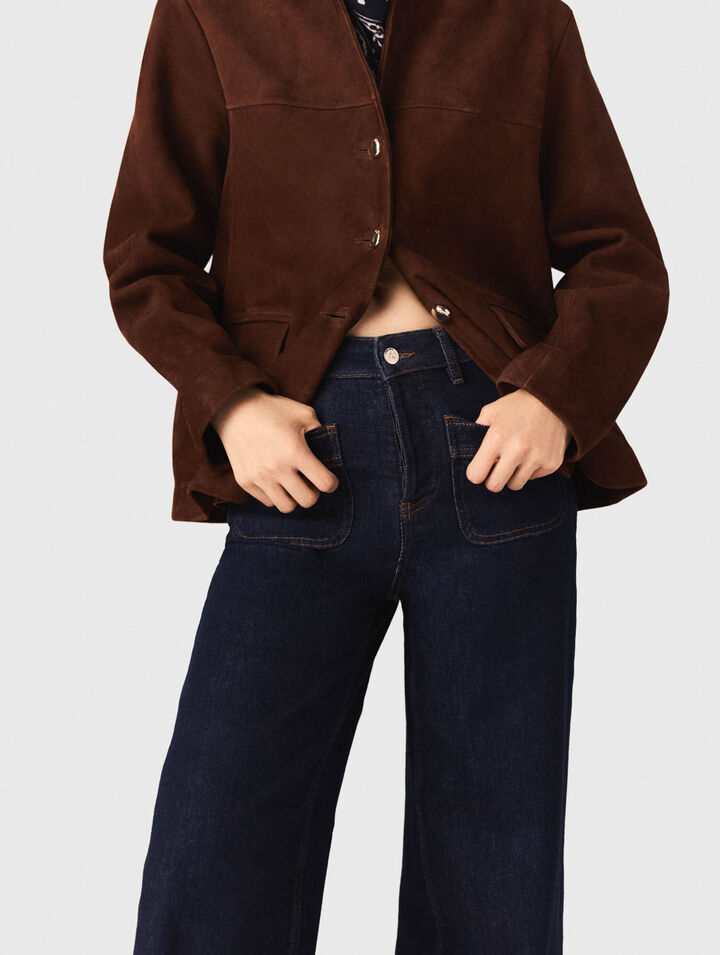 Jeans larghi con tasche applicate