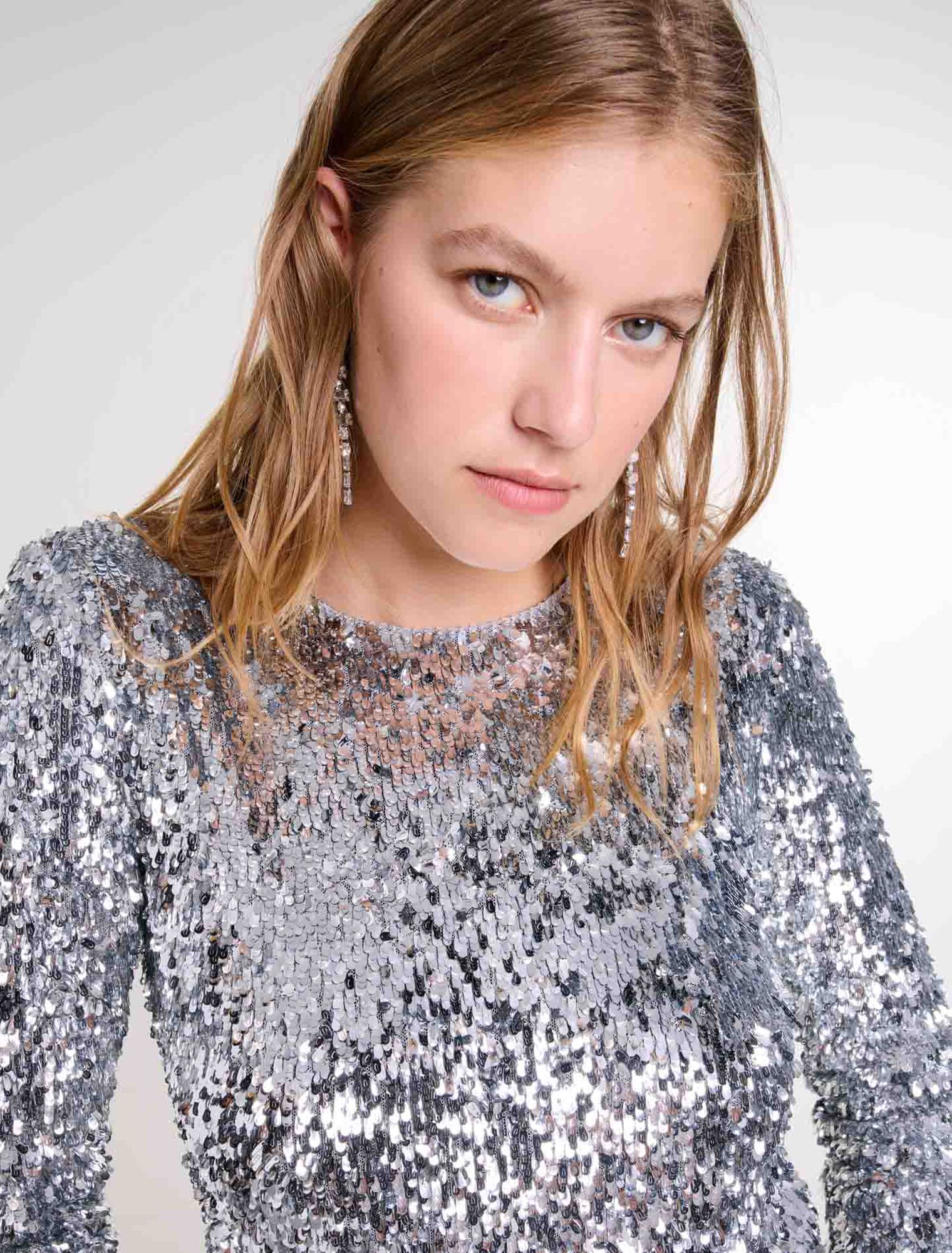 Top a maniche lunghe e paillettes