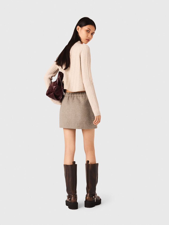 Maglione corto in maglia a trecce