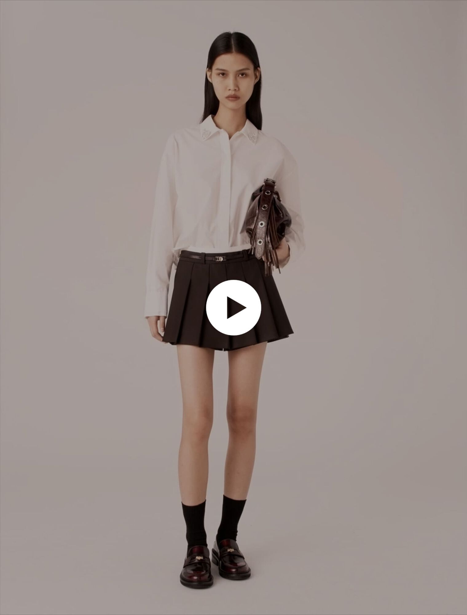 Shorts trompe l'œil plissettati