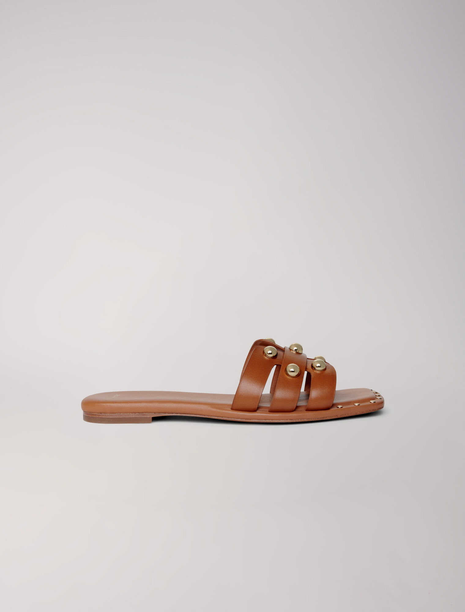 Mules in pelle borchiate
