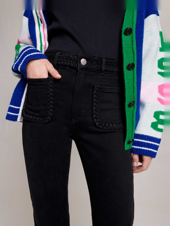 Jeans neri tasche e finiture intrecciate