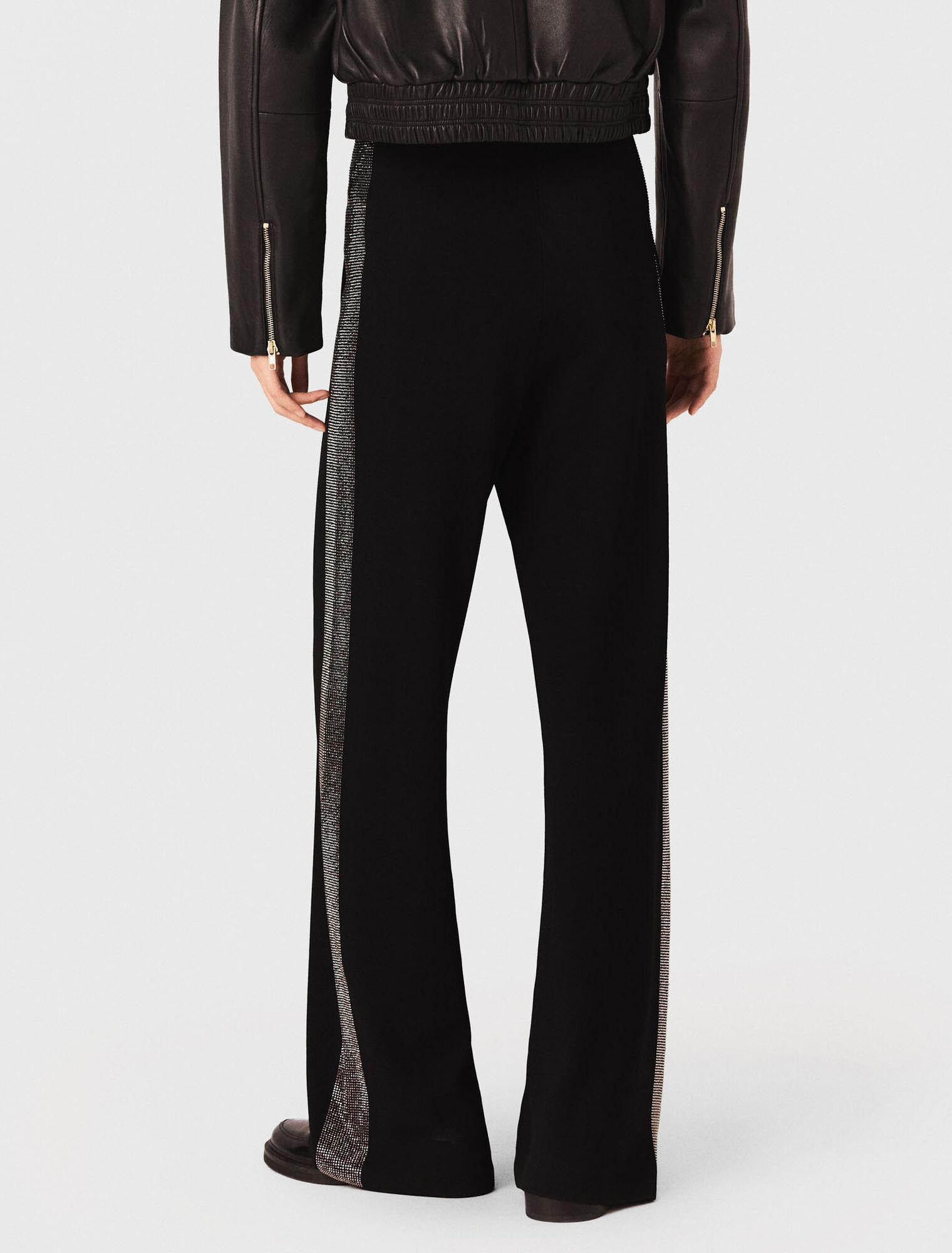 Pantaloni con banda strassata