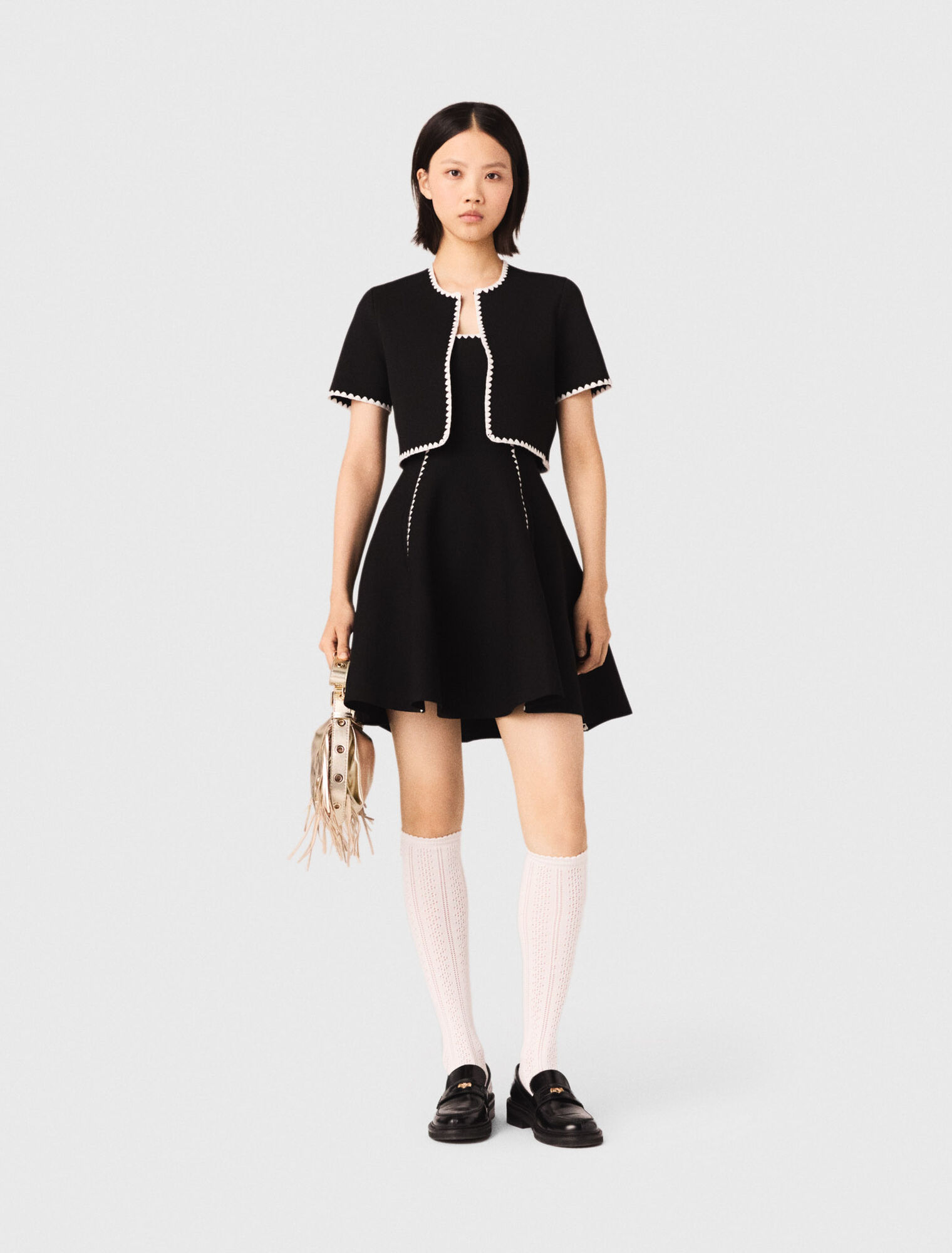 Cardigan corto con impunture