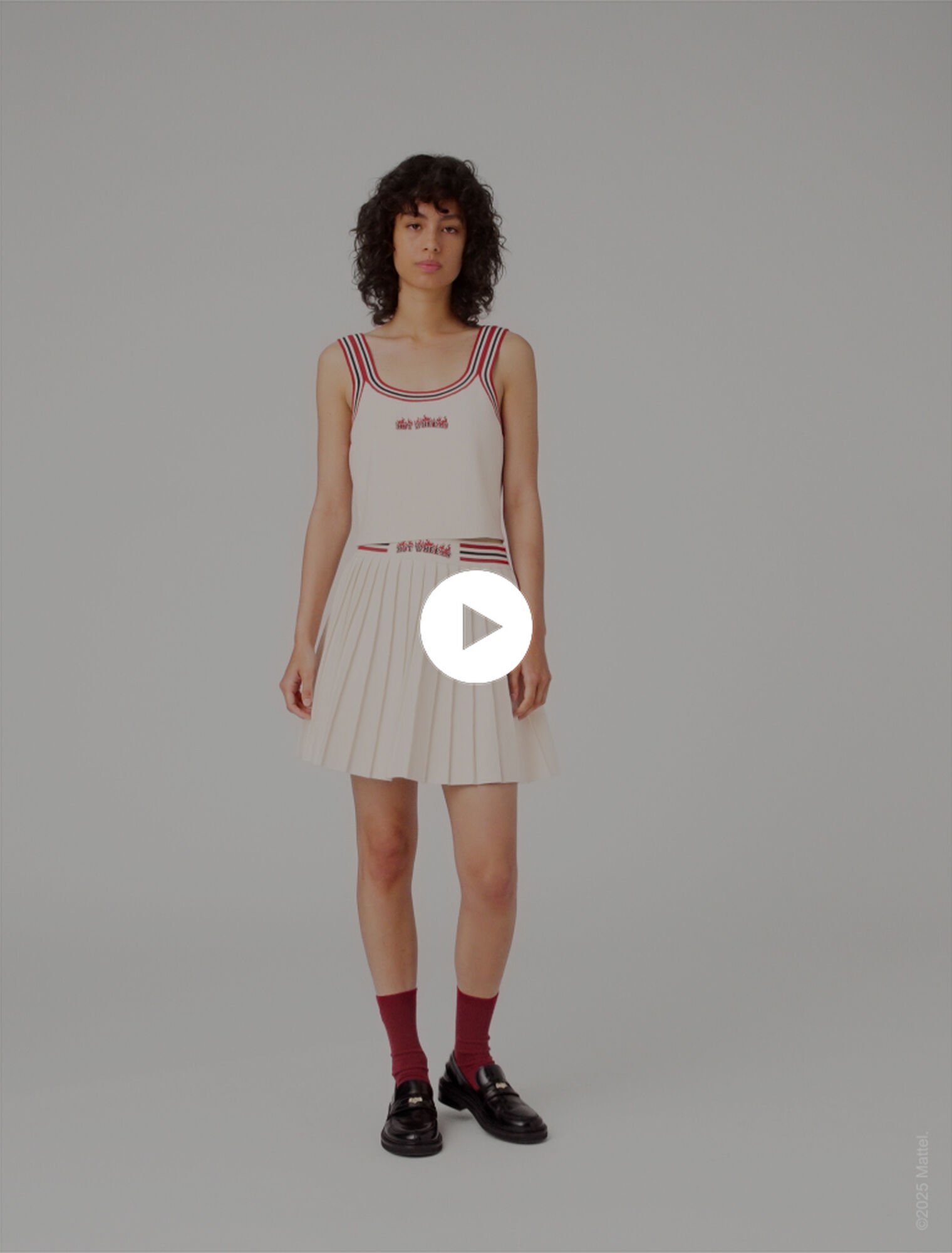 Gonna corta plissettata in maglia