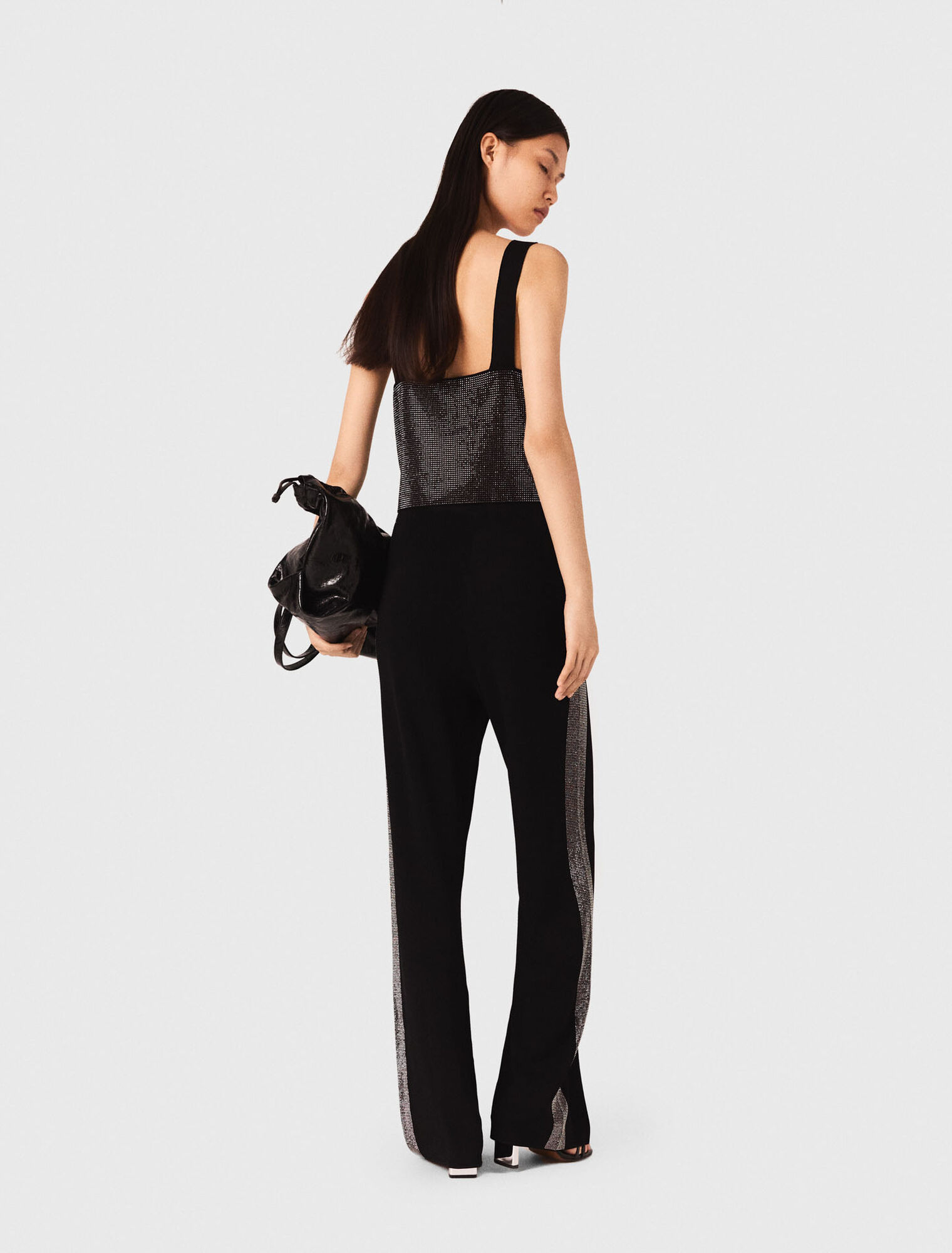 Top in maglia con bretelle e strass