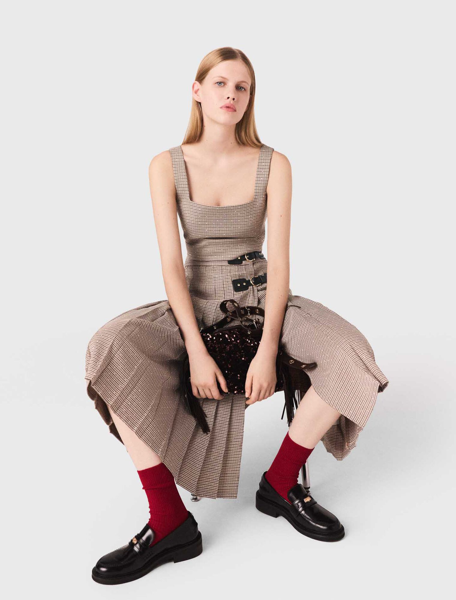 Top a quadri con strass e spalline