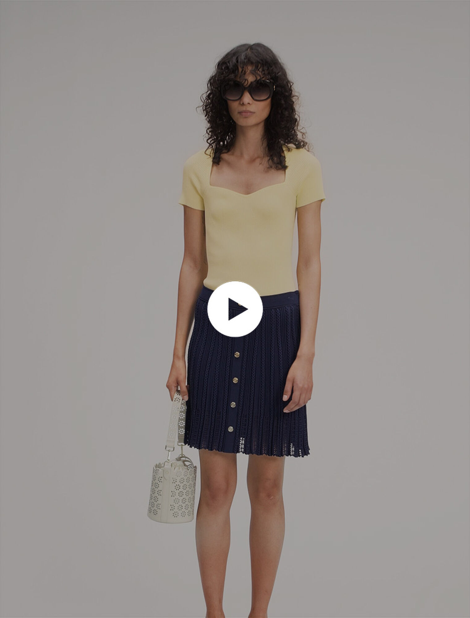 Gonna corta in maglia intrecciata