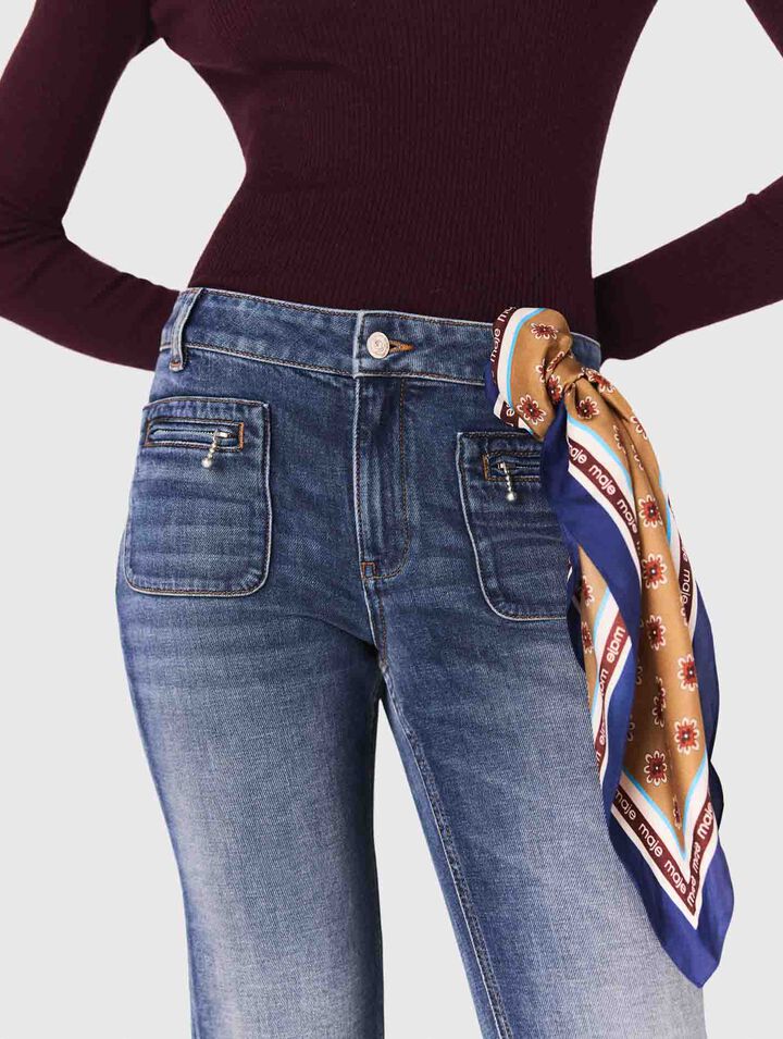 Jeans bootcut con tasche con zip