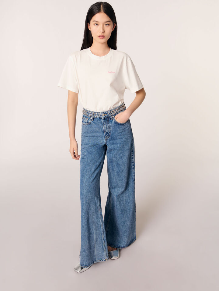 Jeans flare con vita borchiata