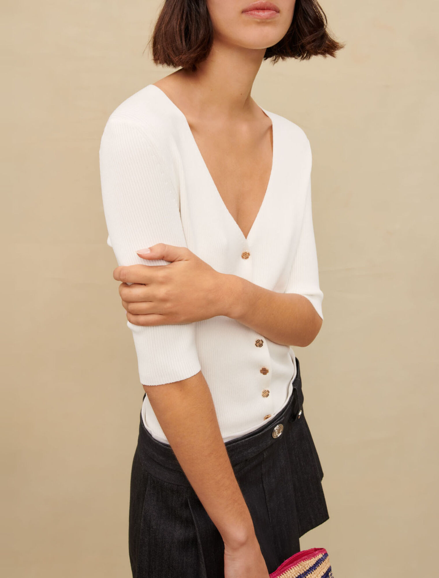 Top a costine con scollo a V