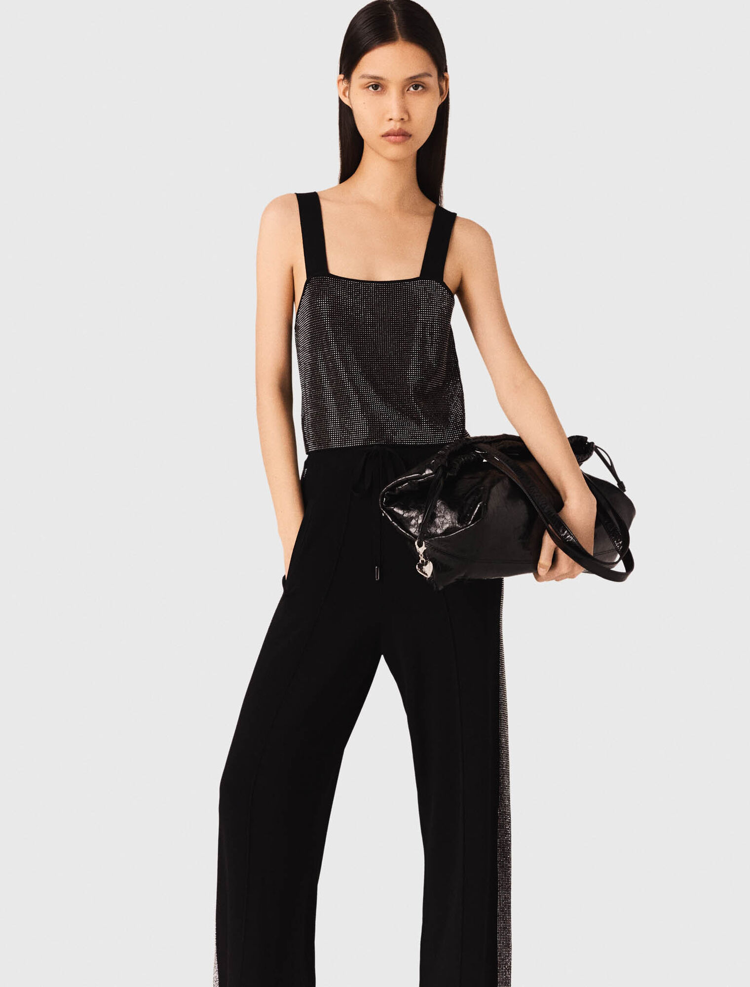 Top in maglia con bretelle e strass