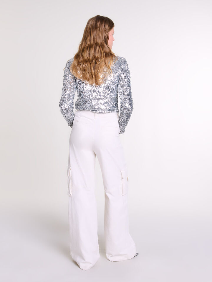 Top a maniche lunghe e paillettes